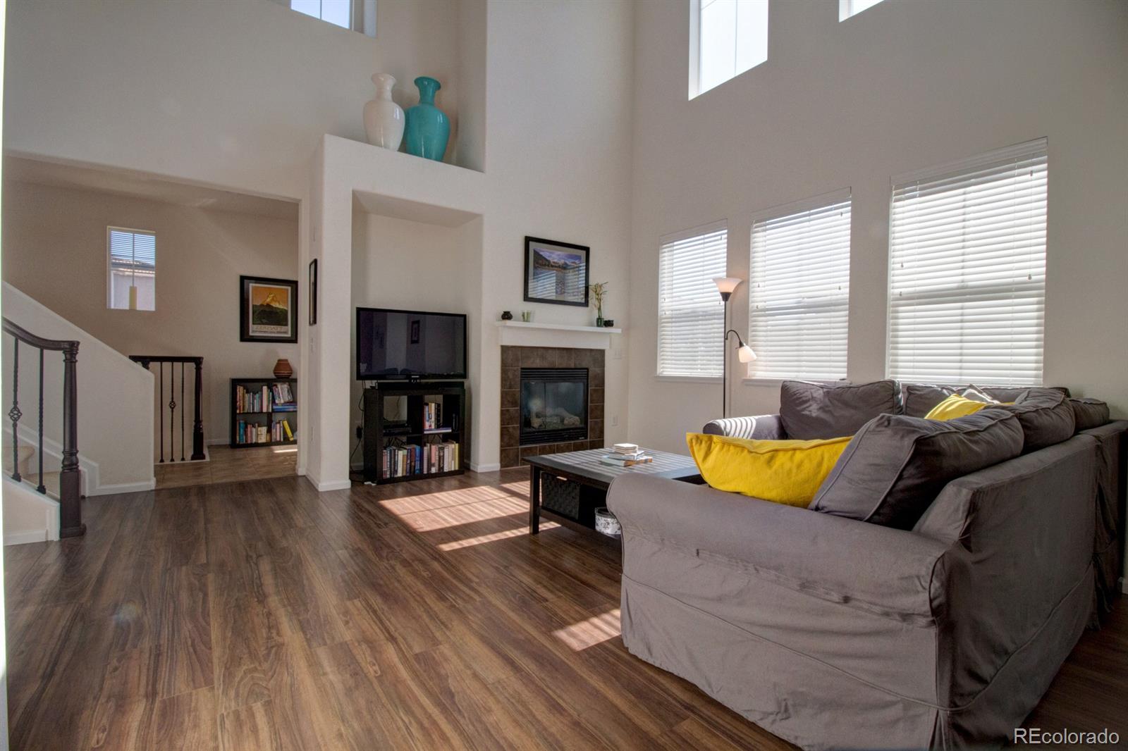 3491 Cascina Place, Unit D Highlands Ranch, CO 80126 - Photo 2 of 22 a living room with furniture fireplace and flat screen tv