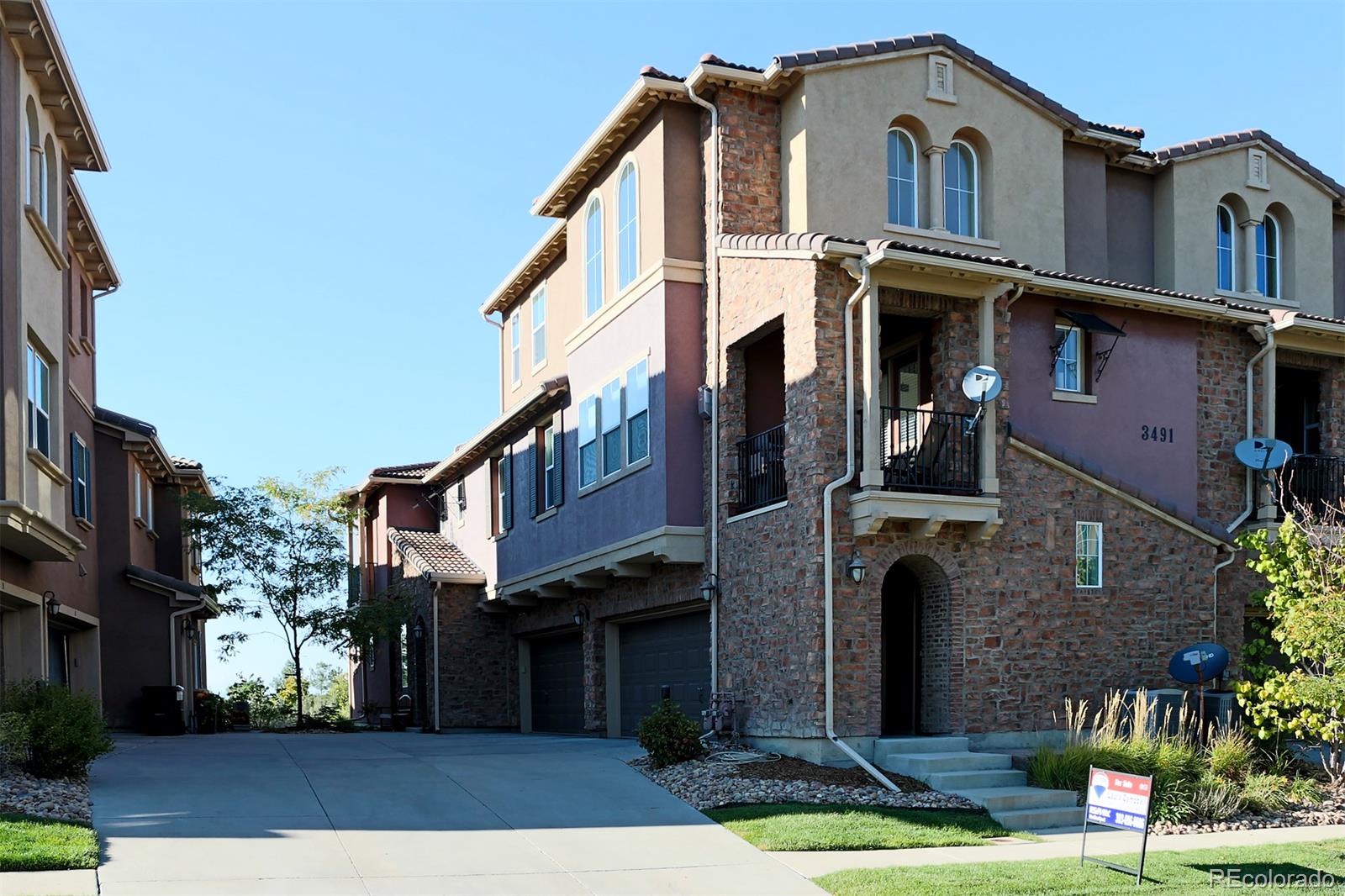 3491 Cascina Place, Unit D Highlands Ranch, CO 80126 - Photo 21 of 22 a front view of a house with a yard
