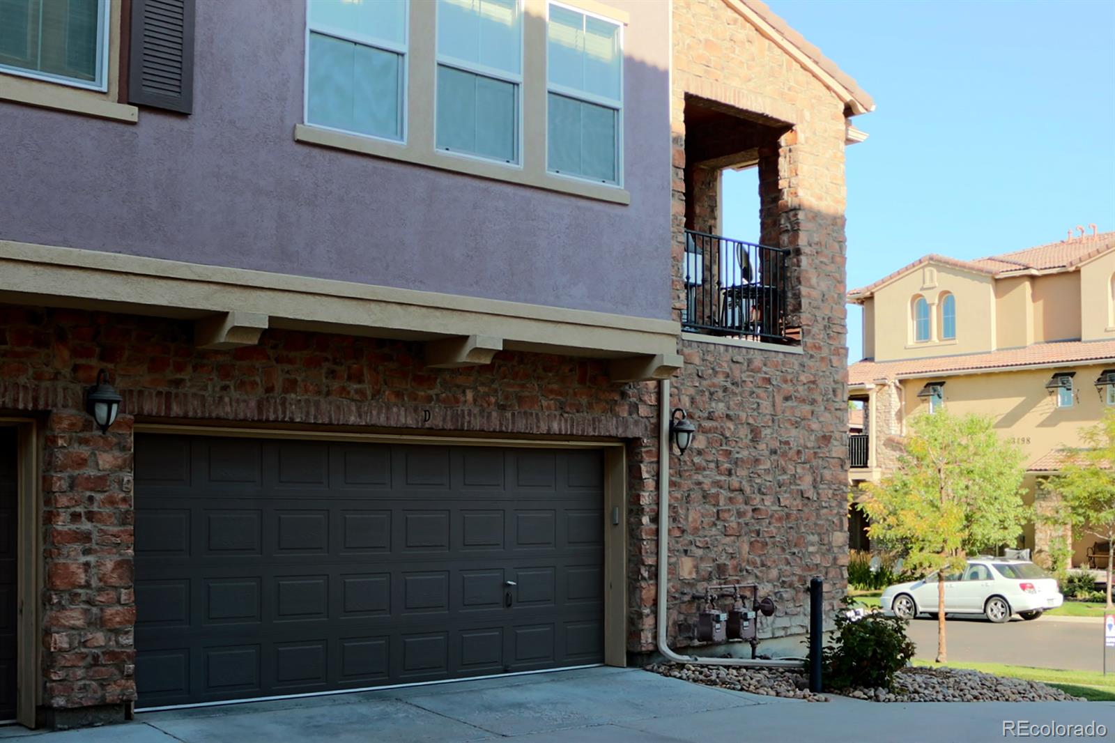 3491 Cascina Place, Unit D Highlands Ranch, CO 80126 - Photo 22 of 22 a brick building with a large windows