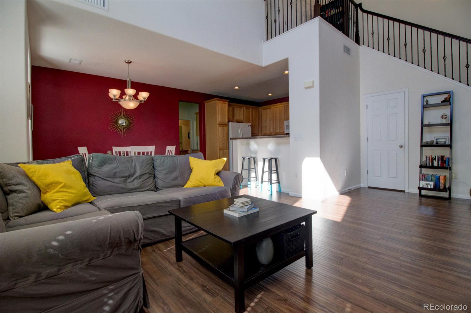 3491 Cascina Place, Unit D Highlands Ranch, CO 80126 - Photo 3 of 22 a living room with furniture and wooden floor