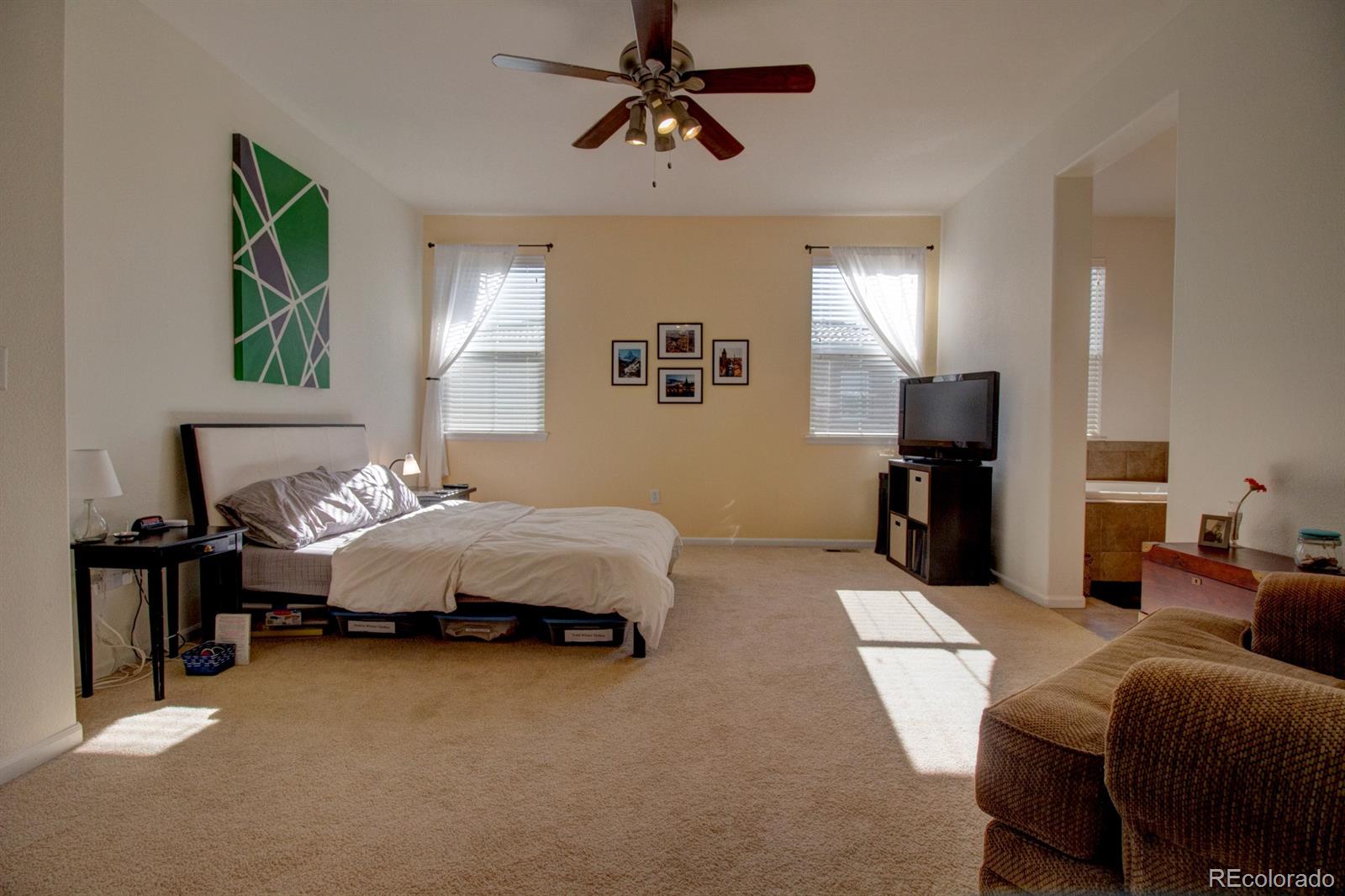 3491 Cascina Place, Unit D Highlands Ranch, CO 80126 - Photo 5 of 22 a bedroom with a bed couch and window