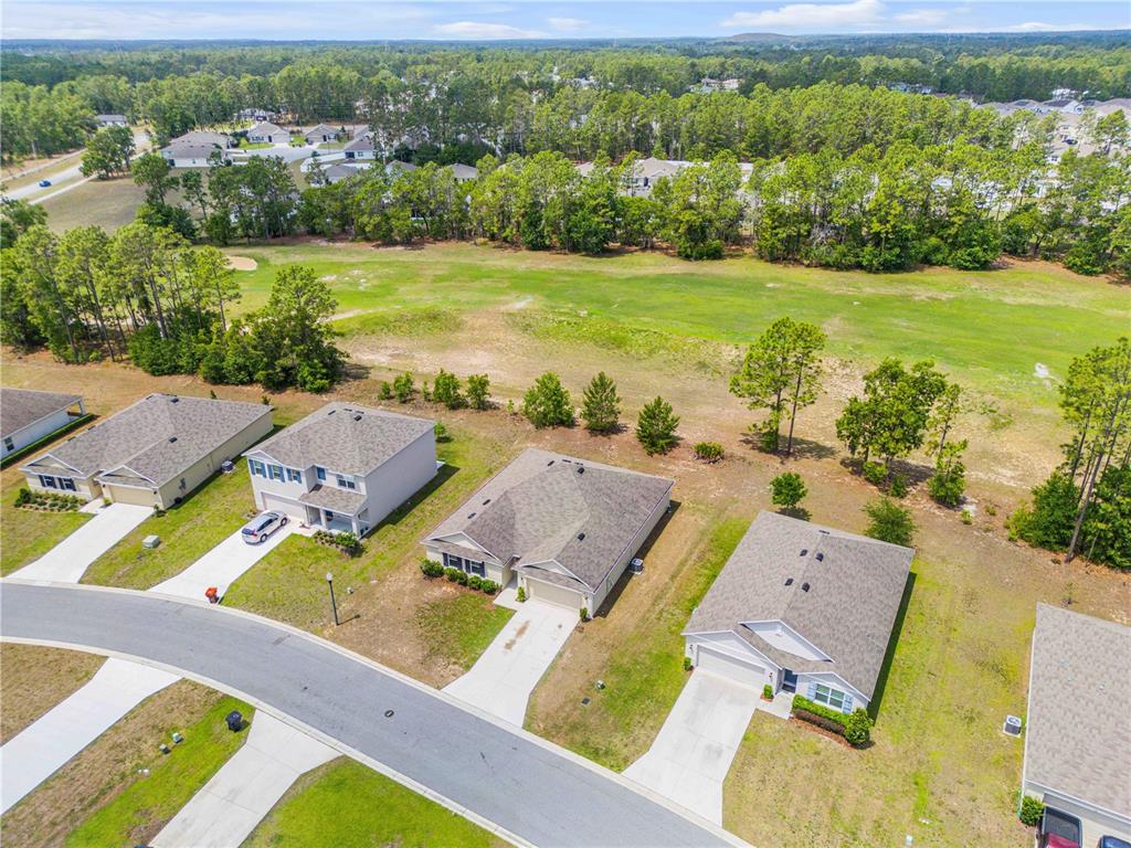 48 Hickory Loop Ocala, FL 34472 - Photo 47 of 52 an aerial view of a house with a garden
