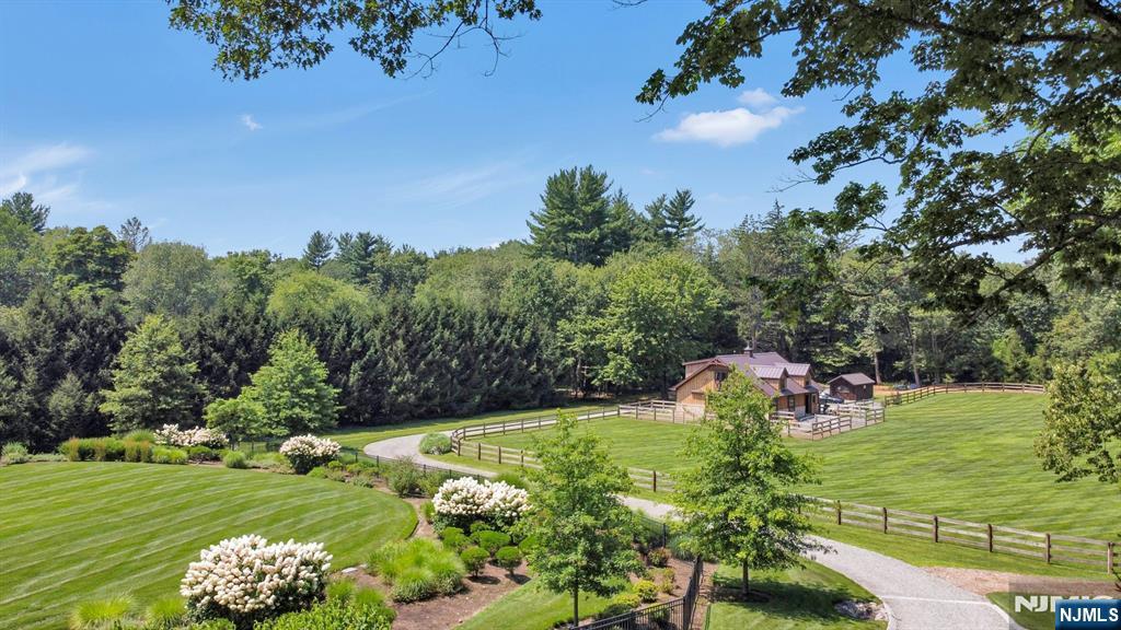 123 East Saddle River Road Saddle River, NJ 07458 - Photo 17 of 50 a view of a golf course with a garden