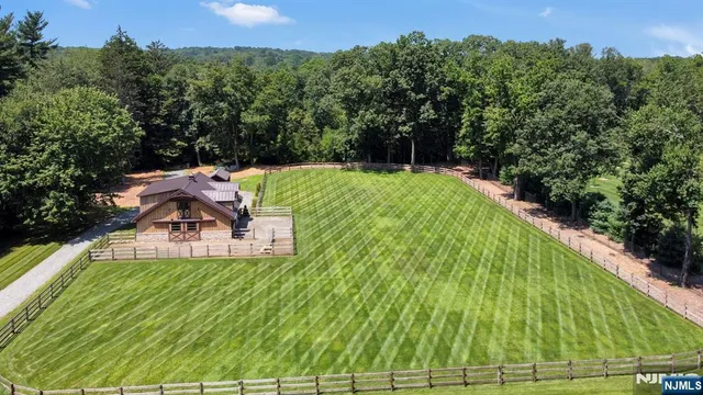 a view of a swimming pool with a yard