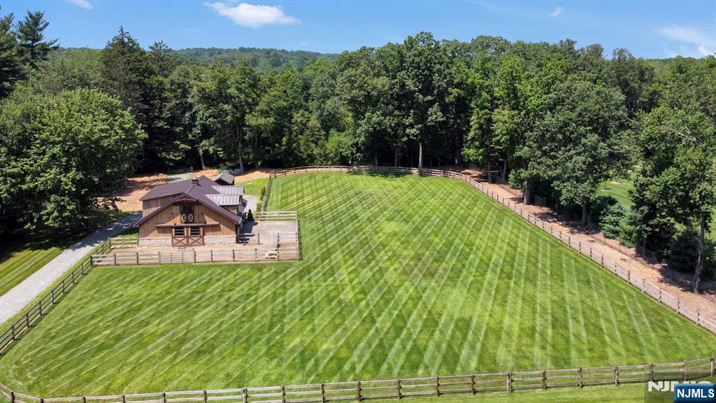 123 East Saddle River Road Saddle River, NJ 07458 - Photo 18 of 50 a view of a swimming pool with a yard