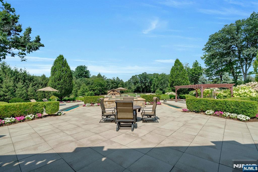 123 East Saddle River Road Saddle River, NJ 07458 - Photo 21 of 50 a view of a backyard with sitting area