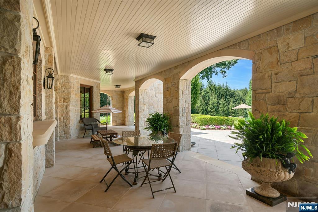 123 East Saddle River Road Saddle River, NJ 07458 - Photo 22 of 50 a dining room with furniture and a potted plant