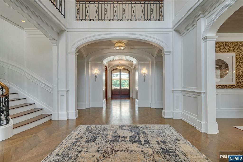 123 East Saddle River Road Saddle River, NJ 07458 - Photo 29 of 50 a view of a hallway with wooden floor and a rug