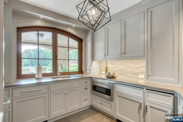 a kitchen with appliances cabinets and a sink
