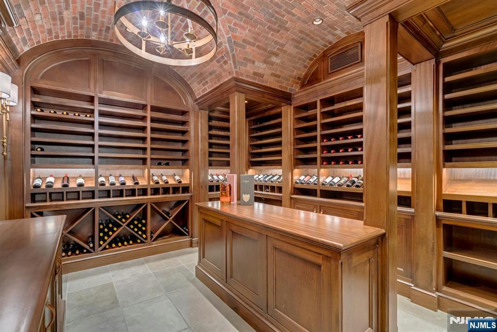 123 East Saddle River Road Saddle River, NJ 07458 - Photo 44 of 50 a kitchen with stainless steel appliances a stove a chimney and a sink