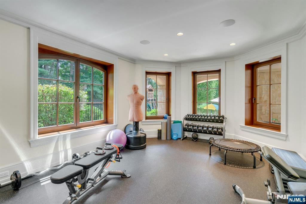 123 East Saddle River Road Saddle River, NJ 07458 - Photo 46 of 50 a living room with furniture and floor to ceiling window