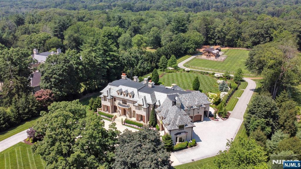 123 East Saddle River Road Saddle River, NJ 07458 - Photo 7 of 50 an aerial view of a house with a yard