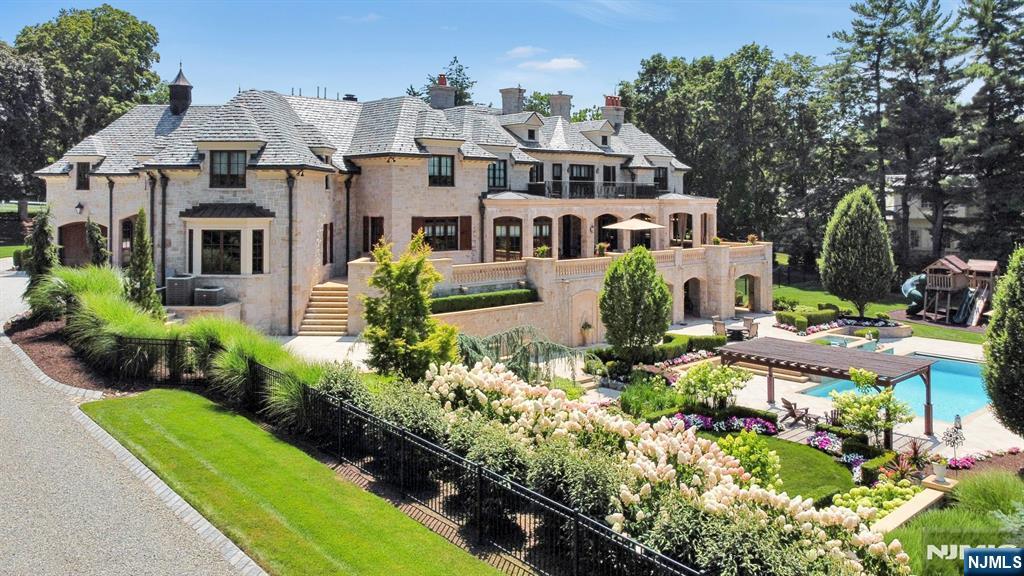 123 East Saddle River Road Saddle River, NJ 07458 - Photo 8 of 50 a aerial view of a house with a yard and potted plants