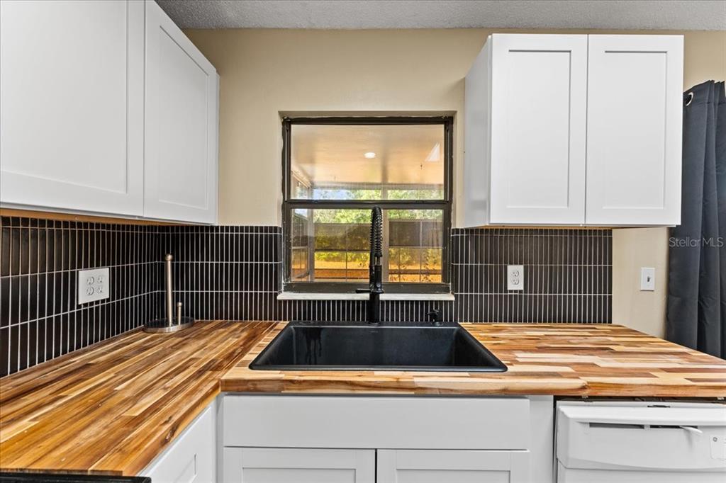 3701 Modesto Street New Port Richey, FL 34655 - Photo 11 of 41 a view of a kitchen with a large window