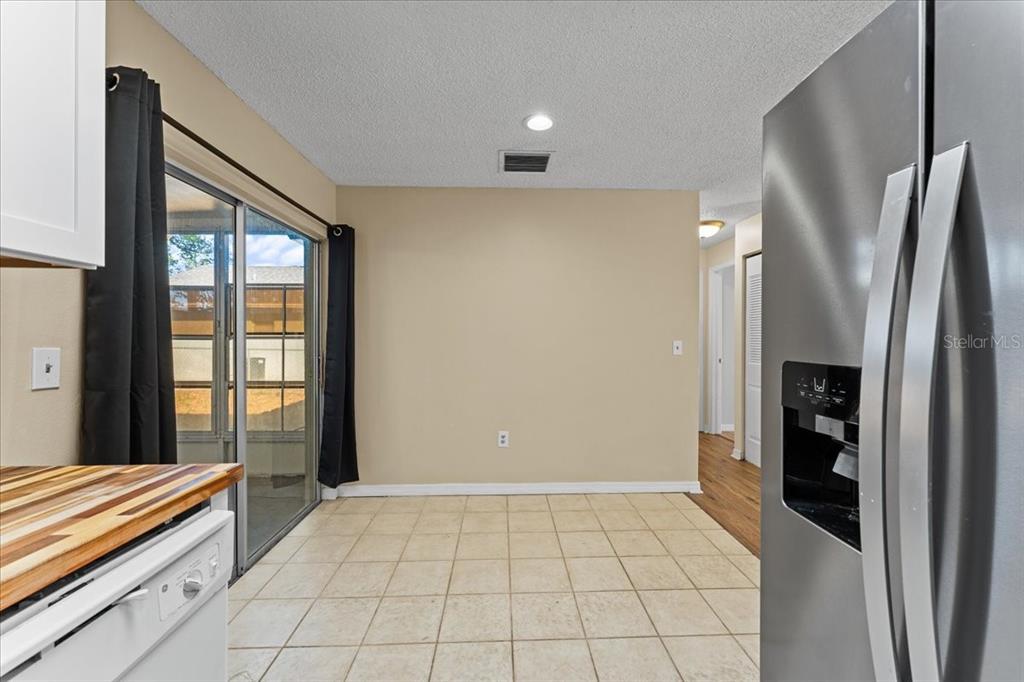 3701 Modesto Street New Port Richey, FL 34655 - Photo 12 of 41 a view of a refrigerator in kitchen and an empty room