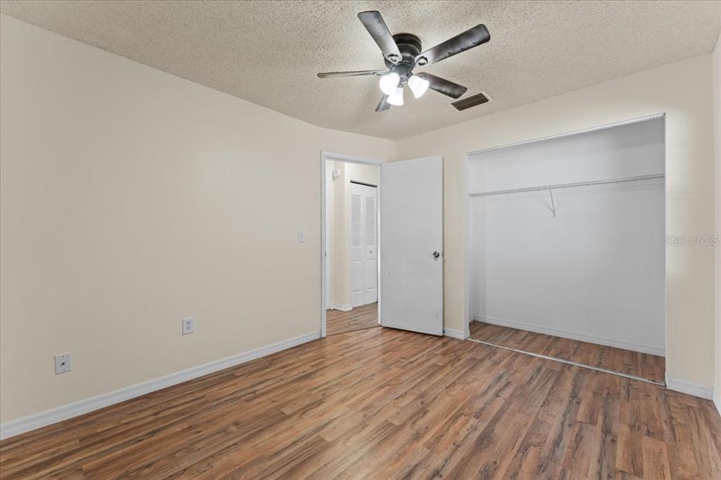 3701 Modesto Street New Port Richey, FL 34655 - Photo 15 of 41 an empty room with wooden floor and windows