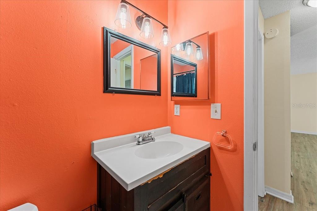 3701 Modesto Street New Port Richey, FL 34655 - Photo 19 of 41 a bathroom with a sink and a mirror