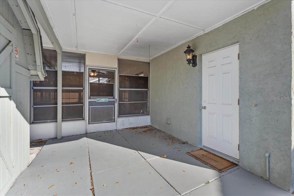 3701 Modesto Street New Port Richey, FL 34655 - Photo 26 of 41 a view of an empty room with wooden floor and windows