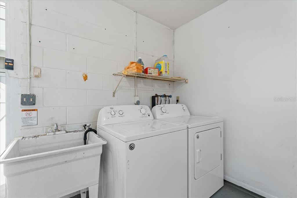 3701 Modesto Street New Port Richey, FL 34655 - Photo 29 of 41 a utility room with dryer and washer