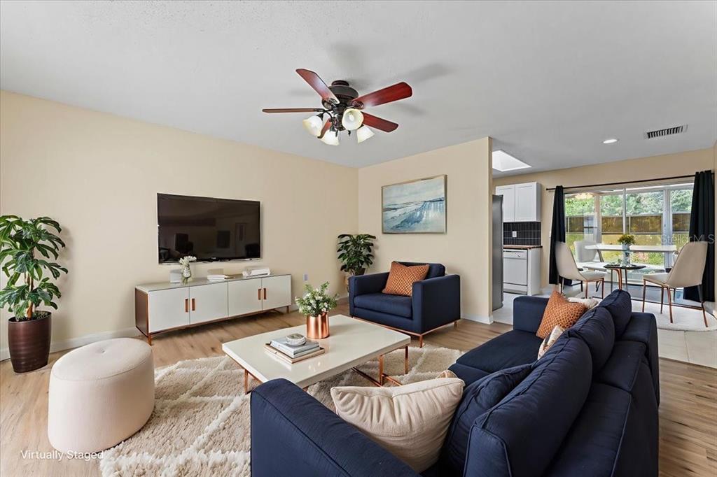 3701 Modesto Street New Port Richey, FL 34655 - Photo 3 of 41 a living room with furniture and a flat screen tv