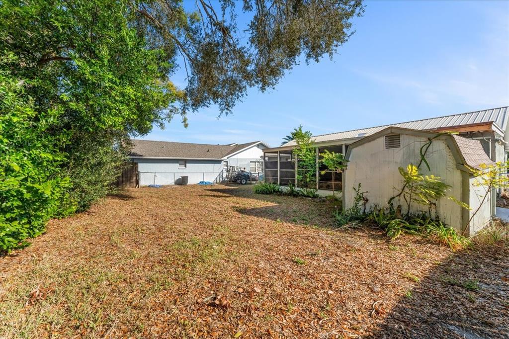 3701 Modesto Street New Port Richey, FL 34655 - Photo 31 of 41 a front view of a house with garden