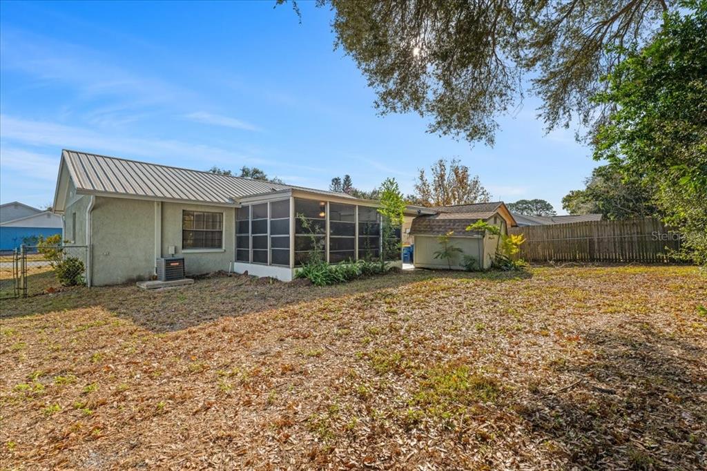 3701 Modesto Street New Port Richey, FL 34655 - Photo 32 of 41 a front view of a house with a garden