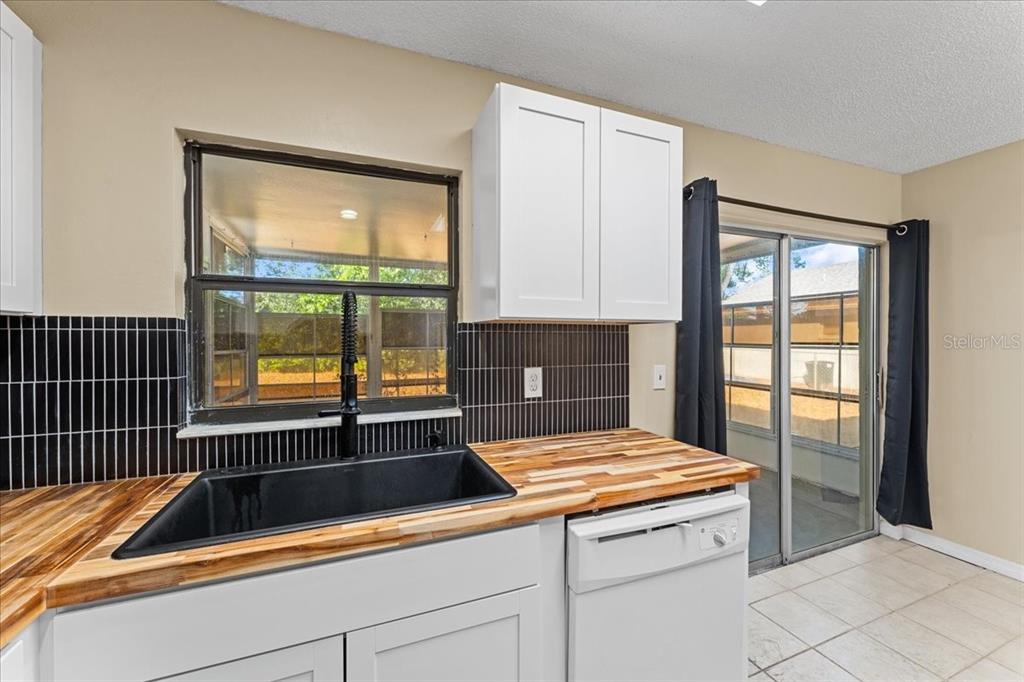 3701 Modesto Street New Port Richey, FL 34655 - Photo 10 of 41 a kitchen with a sink and large window
