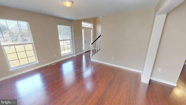 a kitchen with a stove a sink and a refrigerator