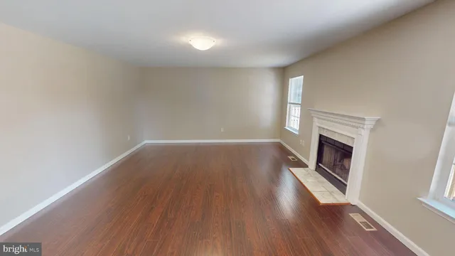 a view of room with window and hardwood floor