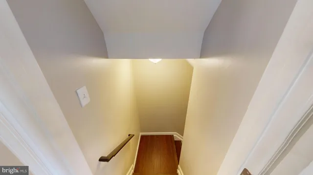 a white toilet sitting next to a white sink