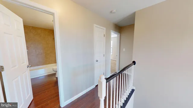 a view of gallery with wooden floor