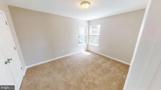 a view of dining room with furniture and wooden floor