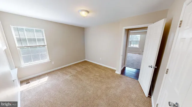 a view of living room with furniture and a table
