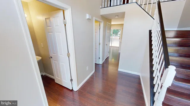 a view of an entryway with wooden floor