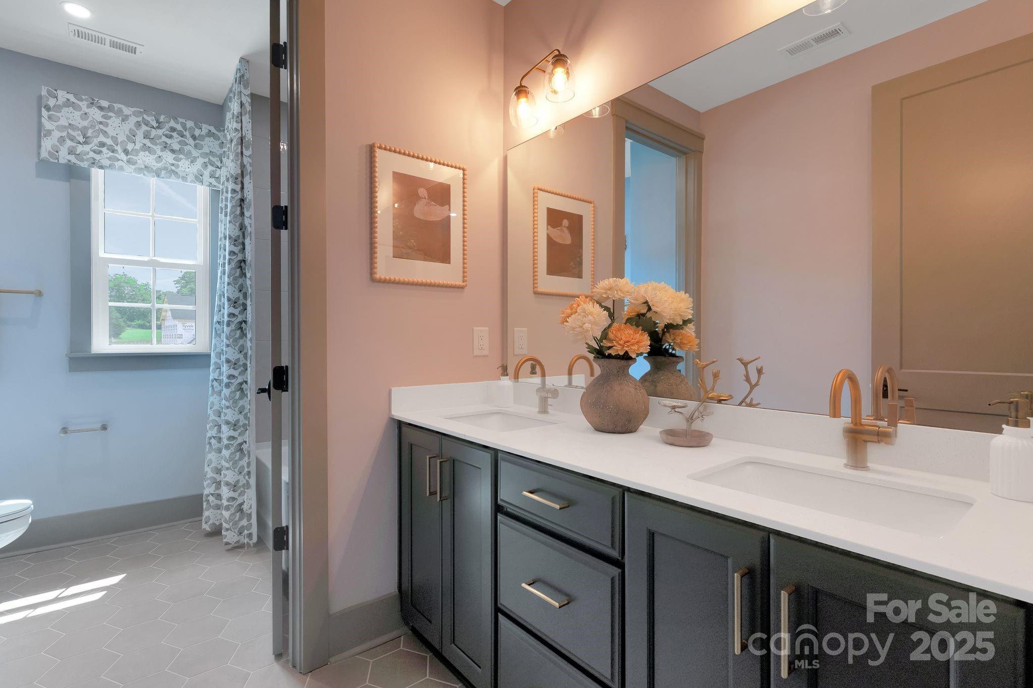 13648 Glennmayes Road Huntersville, NC 28078 - Photo 23 of 32 a bathroom with a sink double vanity and a mirror