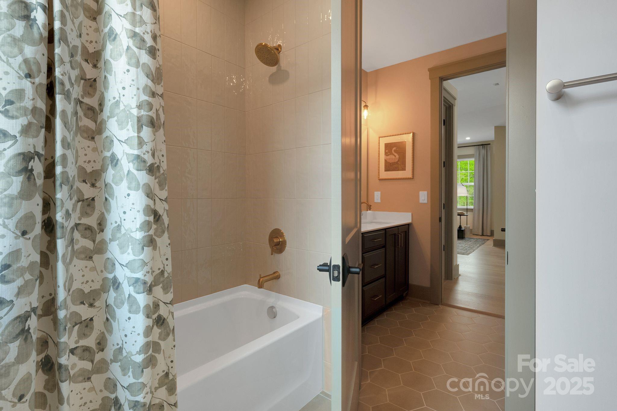 13648 Glennmayes Road Huntersville, NC 28078 - Photo 24 of 32 a bathroom with a tub a sink and a shower