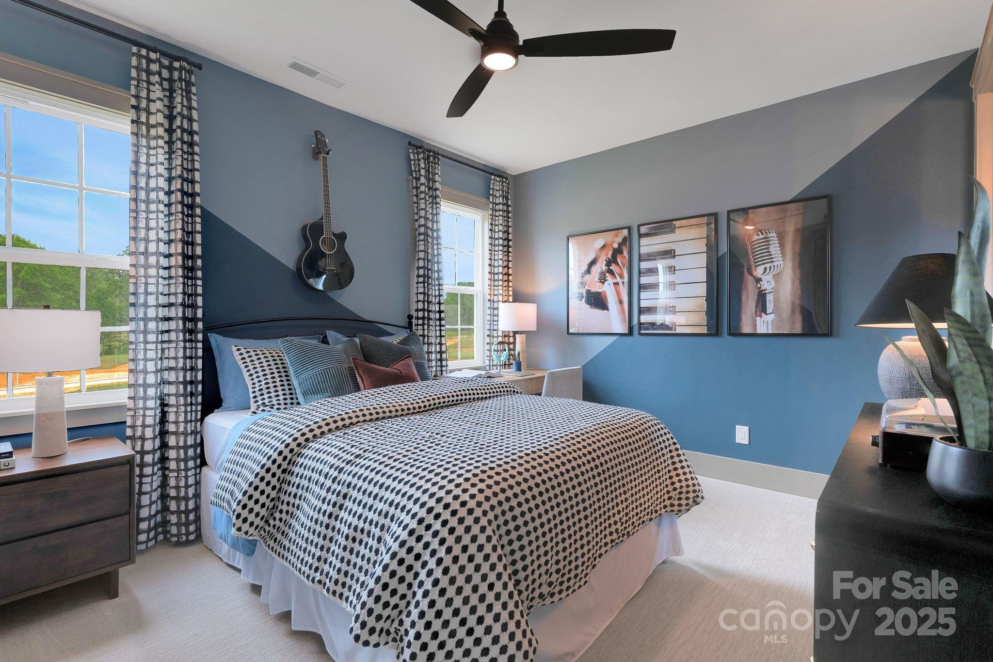 13648 Glennmayes Road Huntersville, NC 28078 - Photo 25 of 32 a bedroom with a large bed and a chandelier