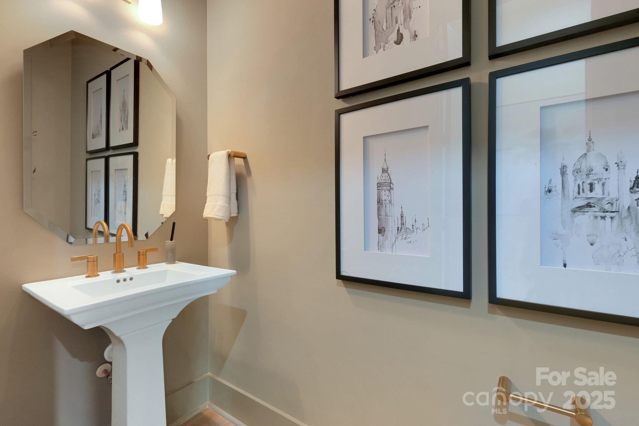 13648 Glennmayes Road Huntersville, NC 28078 - Photo 30 of 32 a bathroom with a sink and a mirror
