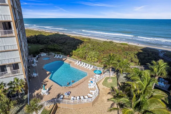 a view of swimming pool from a balcony