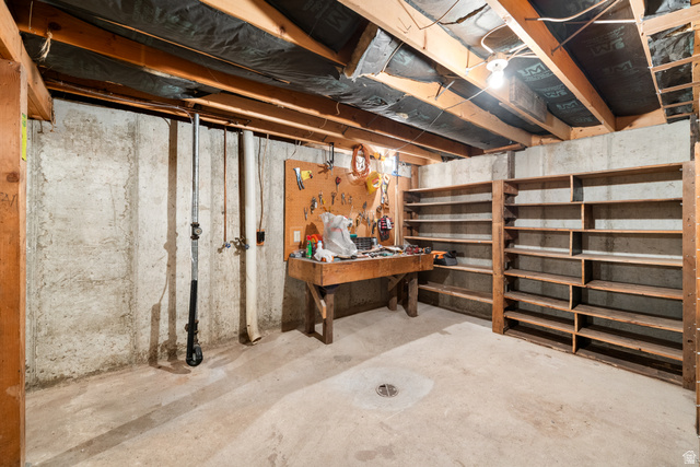 1940 West Old Hwy Road Morgan, UT 84050 - Photo 47 of 73 Unfinished basement space featuring exposed wood joists and concrete walls
