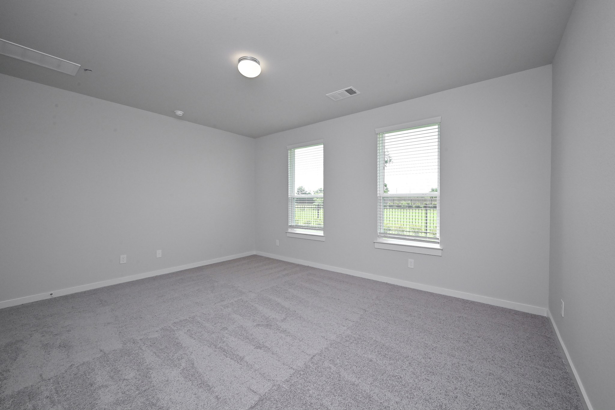 33019 School Hl Road Fulshear, TX 77441 - Photo 14 of 38 an empty room with windows