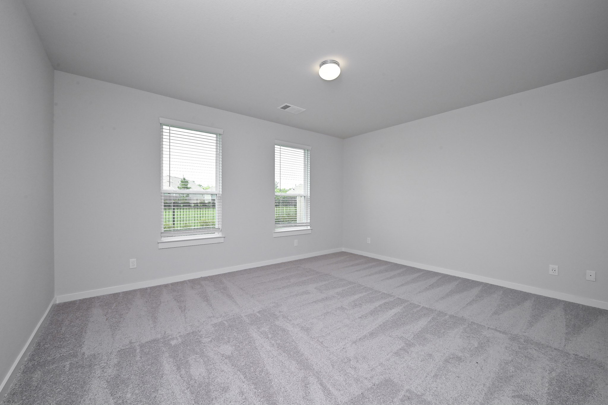 33019 School Hl Road Fulshear, TX 77441 - Photo 15 of 38 an empty room with windows