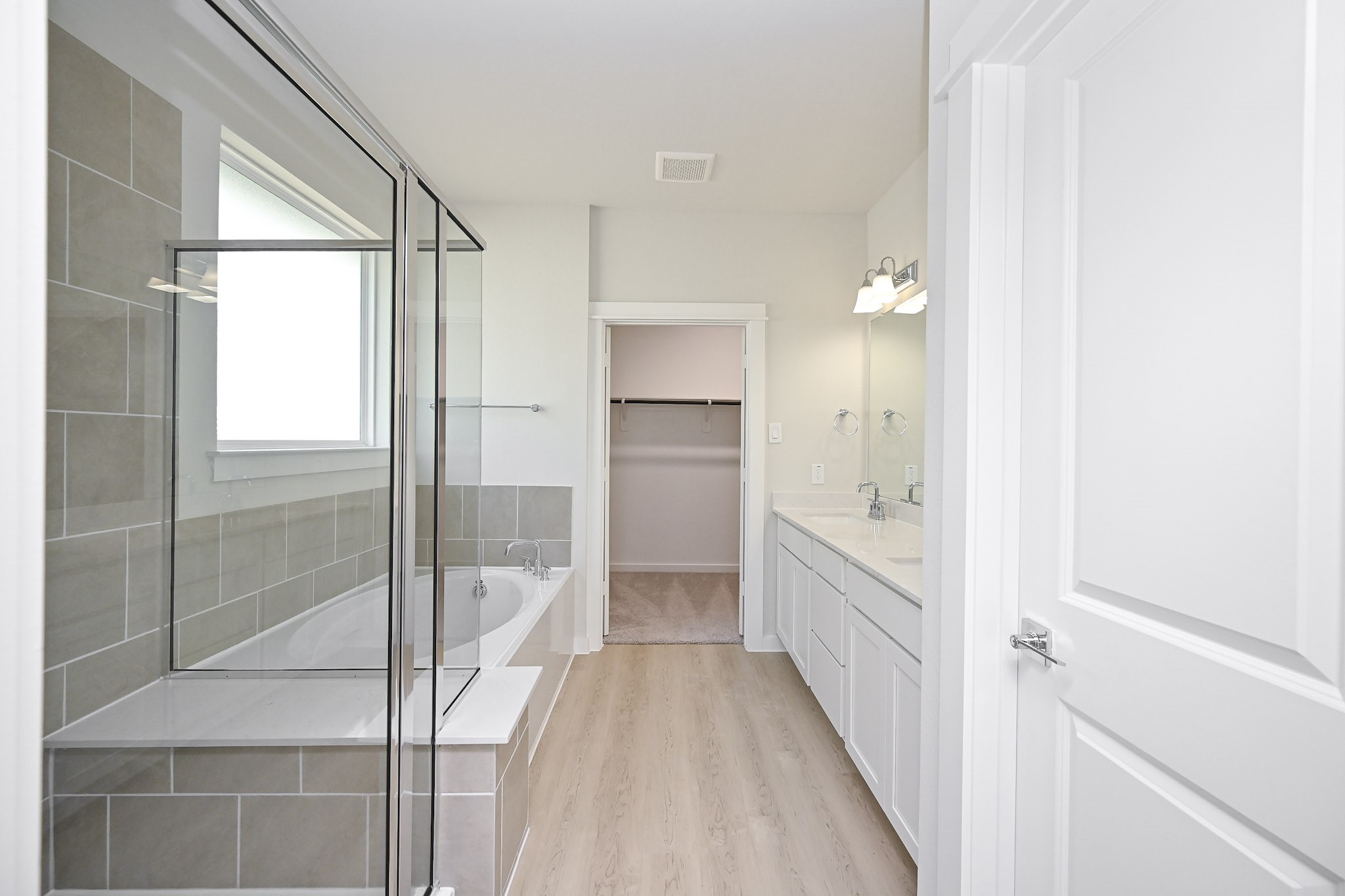33019 School Hl Road Fulshear, TX 77441 - Photo 16 of 38 a bathroom with a bathtub and a shower