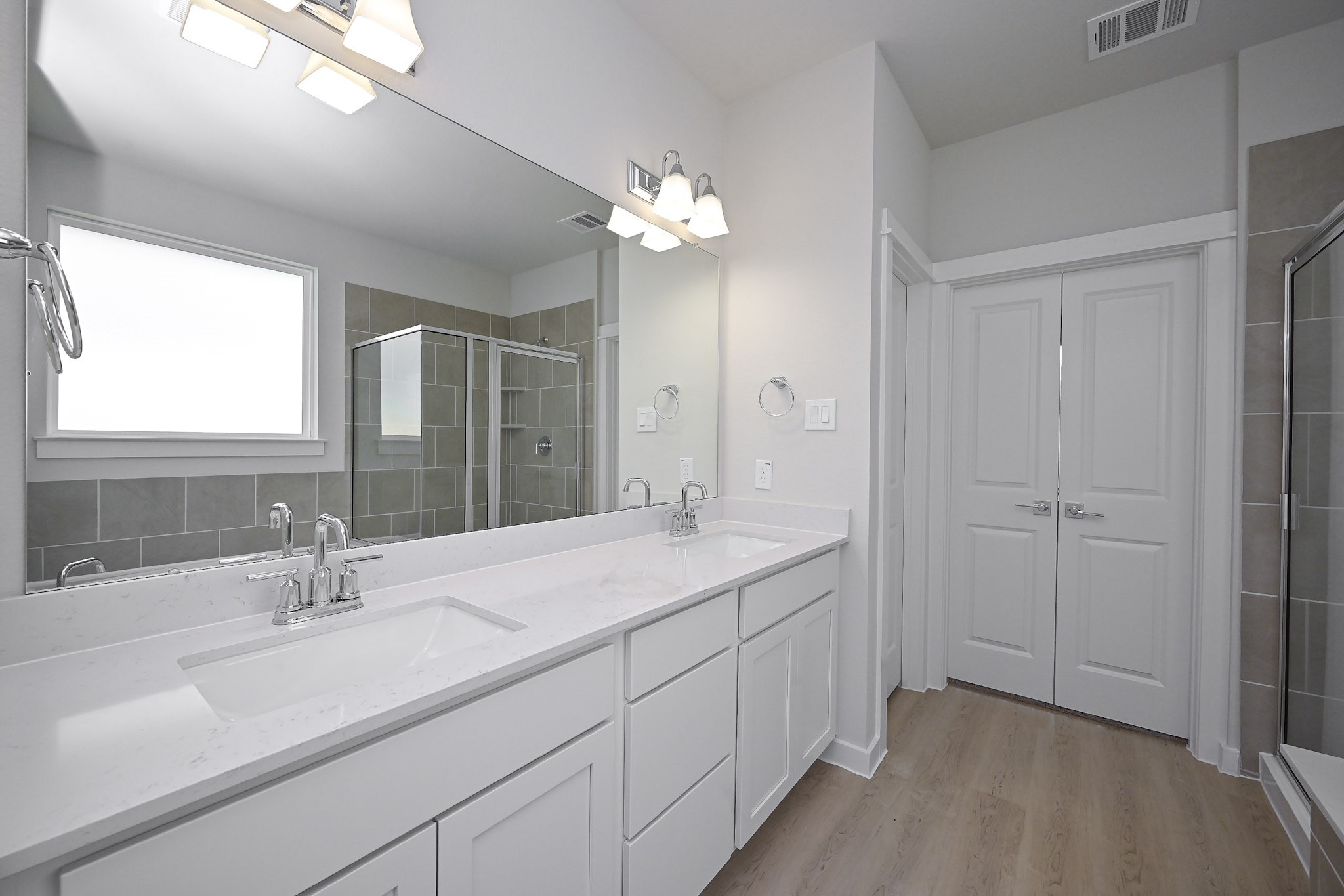 33019 School Hl Road Fulshear, TX 77441 - Photo 19 of 38 a bathroom with a sink a vanity and a mirror