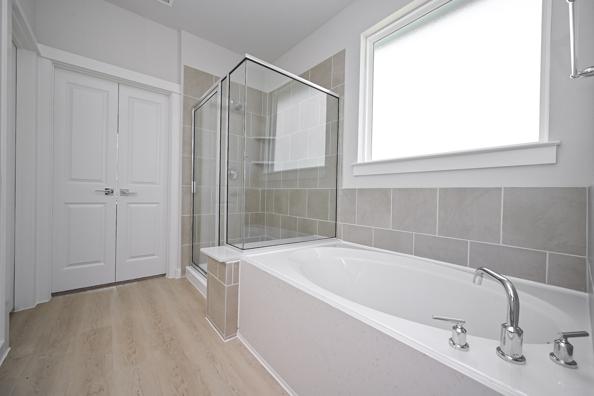 33019 School Hl Road Fulshear, TX 77441 - Photo 24 of 38 a white bath tub sitting next to a shower