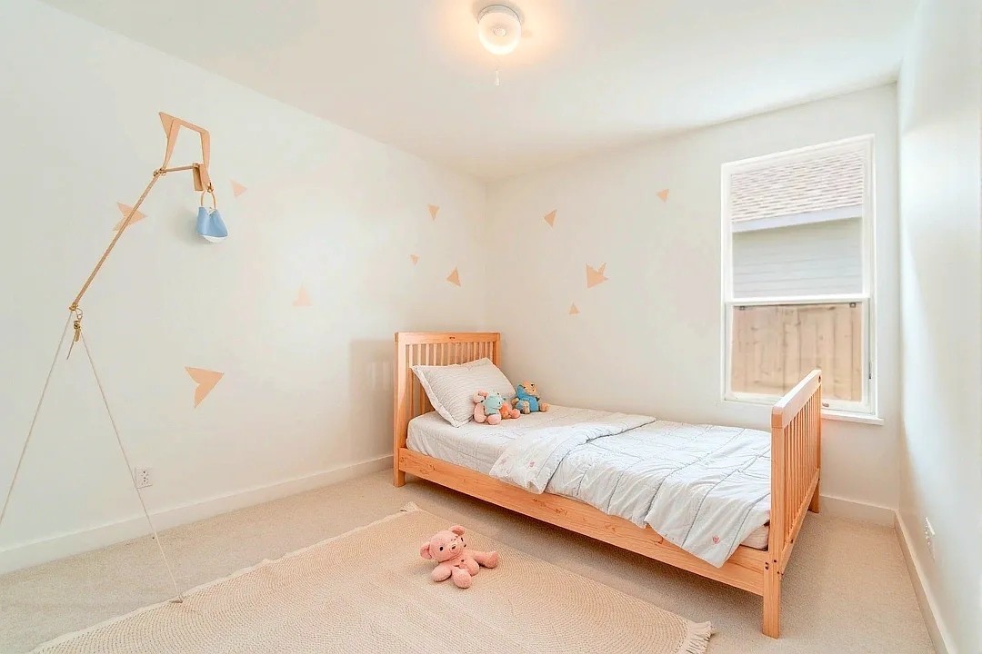 33019 School Hl Road Fulshear, TX 77441 - Photo 26 of 38 a bedroom with a bed and a window