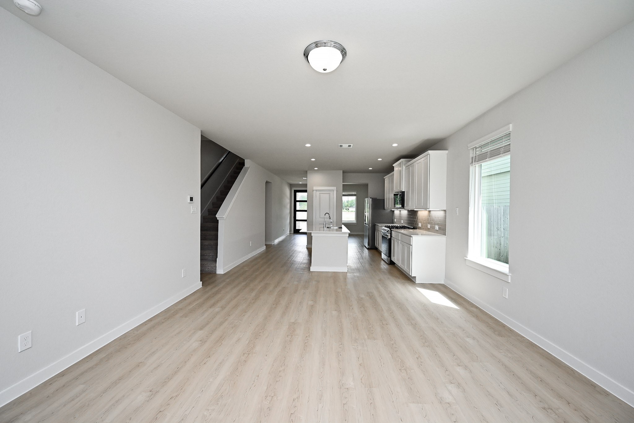 33019 School Hl Road Fulshear, TX 77441 - Photo 27 of 38 a view of empty room with wooden floor