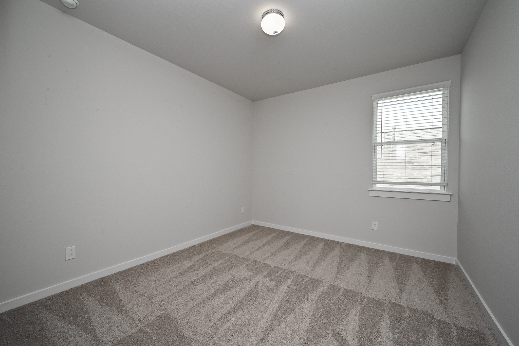 33019 School Hl Road Fulshear, TX 77441 - Photo 28 of 38 an empty room with a window