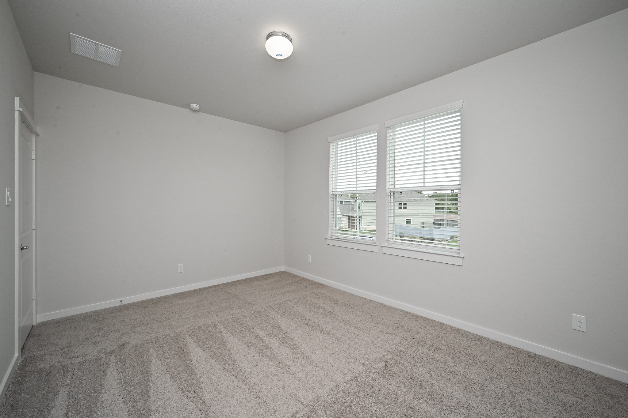 33019 School Hl Road Fulshear, TX 77441 - Photo 29 of 38 an empty room with windows