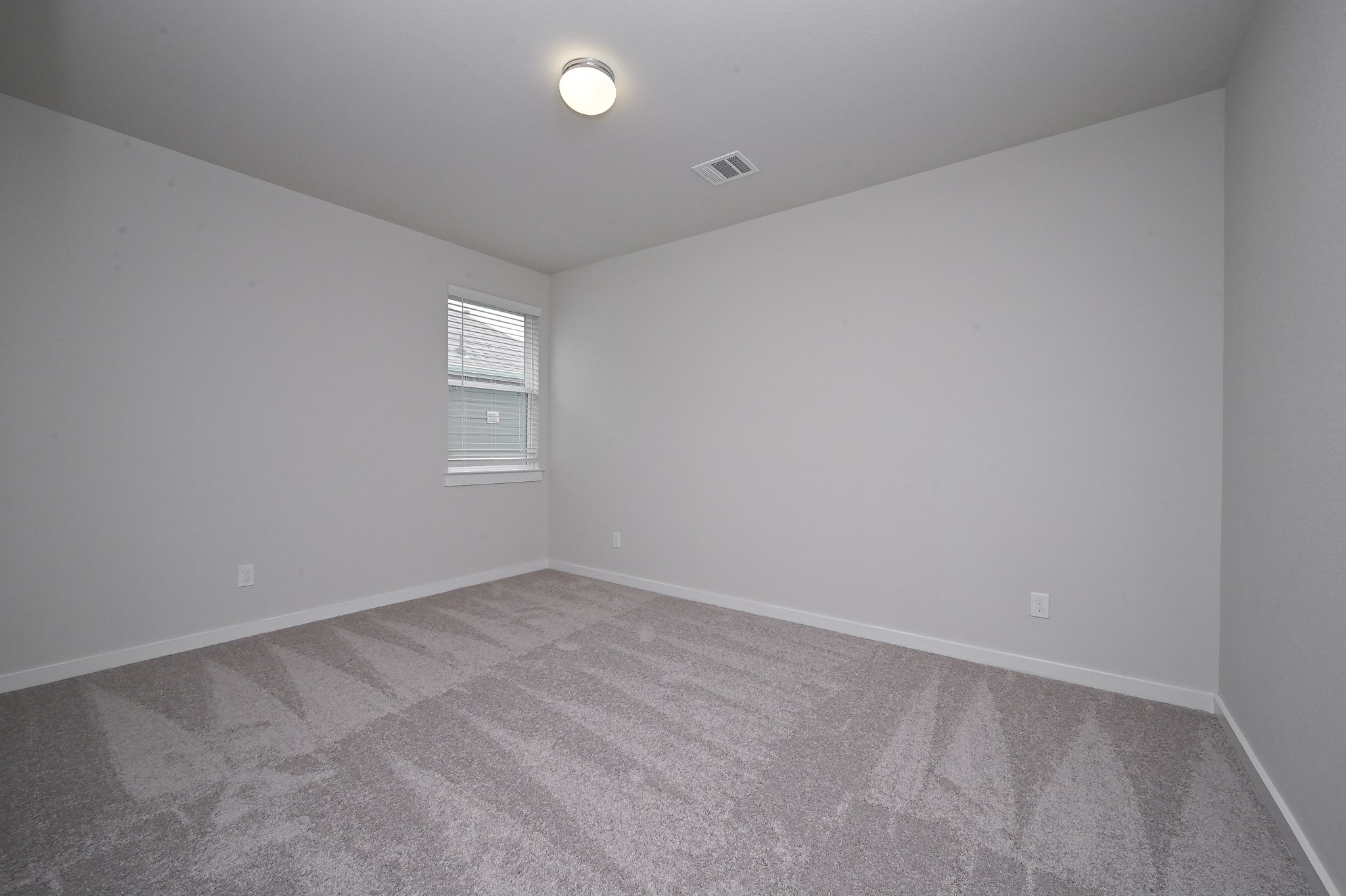 33019 School Hl Road Fulshear, TX 77441 - Photo 30 of 38 an empty room with windows and closet